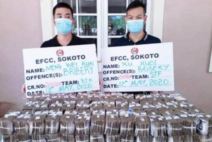* Mr Meng Wei Kun (L) and Mr Xu Kuai (R) paraded with the 50,000.000. 00 they attempted to bribe Sokoto Zonal Head of EFCC Command with to compromise investigation against their company, China Zhongoa Ltd.
