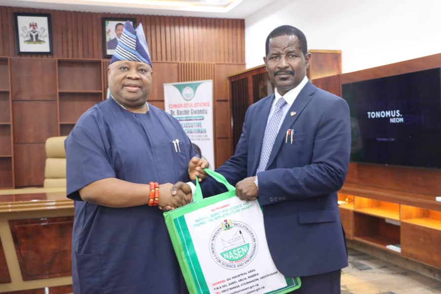 *  (R):  Senator Ademola Adeleke, Osun State Governor and Dr Bashir Gwandu, the Ede Vice Chairman/CEO  of NASENI, at the presentation of NASENI's souvenir to the governor by Dr Gwandu during the courtesy  visit of Adeleke to the Agency headquarters in Abuja on Thursday.