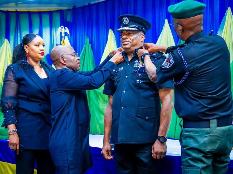 Governor Otti and IGP Egbetokun decorate CP Ifeanyi Uche with his new rank.