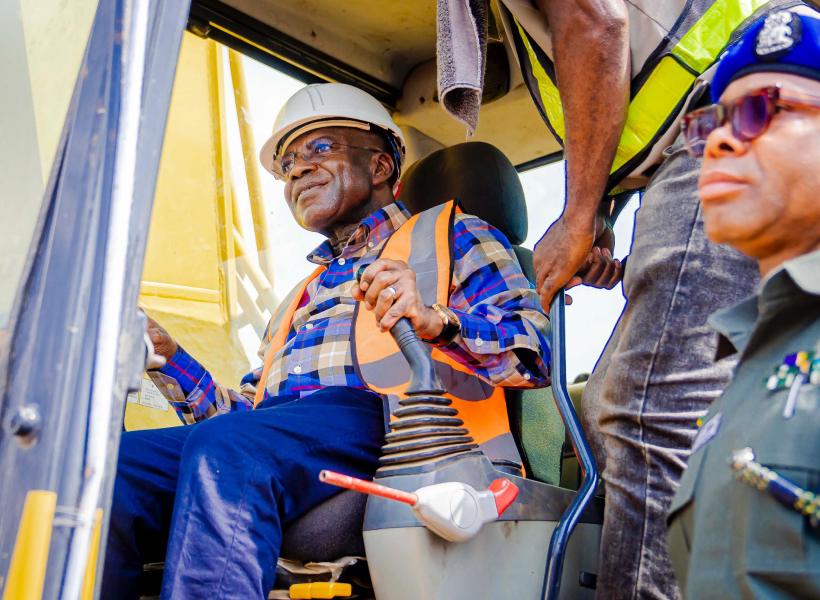 Leading the charge, Governor Otti operates the excavator to flag-off the road work.