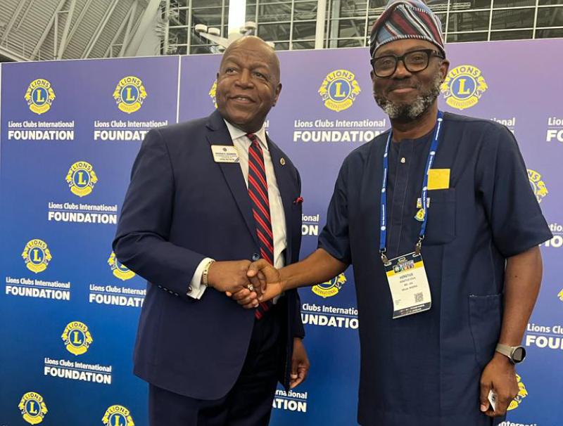 *  Lion Horatious Egua, Publisher of The Bridge Online Newspaper (R) and Lion Douglas X. Alexander (L) during the decoration event.