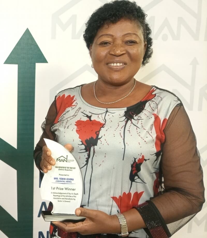 Mrs Yemisi Izuora with her MAN Reporter Award