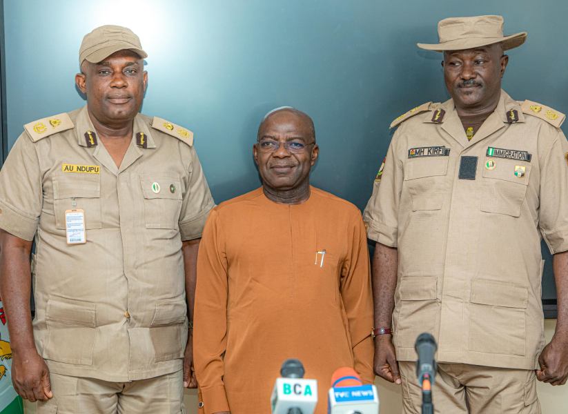 Governor Alex Otti (middle) with the outgoing immigration boss, CIS Ndupu (left), and the incoming CIS, Mohammed Kirfi (right).
