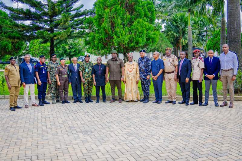 *  Governor Otti (8th from left) and Deputy Governor, Engr Ikechukwu Emetu, with the  security chiefs and other senior government officials in a group photograph after the meeting.