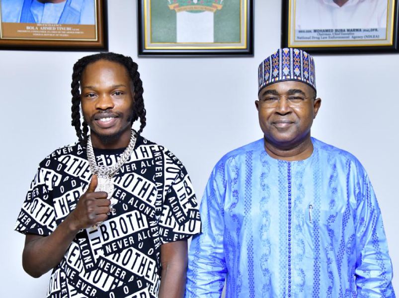 *  Popular Musician, Naira Marley (L) and Brig-Gen Mohammed Buba Marwa, Chairman/CEO of NDLEA (R) during Marley's solidarity visit to the narcotics agency's headquarters in Abuja on Thursday. 