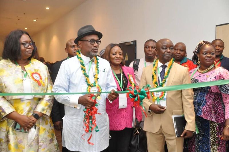 The Executive Secretary Nigerian Content Development and Monitoring Board, Engr. Simbi Kesiye Wabote, with the Principal of the Petroleum Training Institute (PTI), Dr. Henry Adimula, cutting the exhibition tape at the 3rd Biennial International Conference on Hydrocarbon Science and Technology, in Abuja.