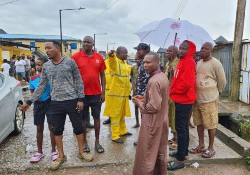 NEMA official battling to manage the Lagos flood situation on Saturday.