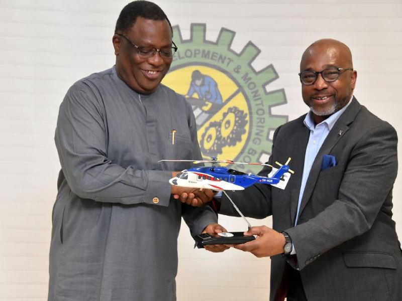 Managing Director of Bristow Helicopters Nigeria, Mr. Oladapo Oyeleke exchanging gifts with the Executive Secretary of the NCDMB, Engr. Felix Omatsola Ogbe, after the courtesy at the Board’s headquarters in Yenagoa, Bayelsa State.