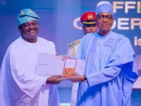 *  L-R: Mr Femi Adesina, Special Adviser to President Muhammadu Buhari receiving his OON National Honours Award from the boss on Tuesday.