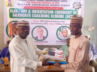 *  Sokoto State Coordinator of NDE, Muhammad Umar Sanda Gusua, presenting materials to one of the supervisors of the GCS flag-off ceremony held on Thursday in Sokoto. .Photo By: Ankeli Emmanuel 