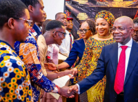 *  Governor Alex Otti (right), his wife, Priscilla (middle), and the Commissioner for Education, Prof Uche Eme-Uche (behind Mrs Otti), congratulate the Scholarship recipients.