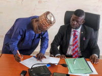  L-R: Mr. Attahiru Iliyasu, Acting Head of Research & Development Department and Dr. John A. Hemen, Overseeing Officer, SEDI-Minna during the signing of performance bond at the Institute.