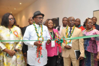 The Executive Secretary Nigerian Content Development and Monitoring Board, Engr. Simbi Kesiye Wabote, with the Principal of the Petroleum Training Institute (PTI), Dr. Henry Adimula, cutting the exhibition tape at the 3rd Biennial International Conference on Hydrocarbon Science and Technology, in Abuja.